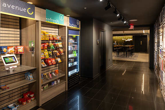 A vending machine with a variety of snacks and a digital display.