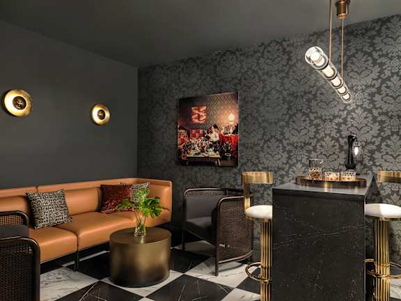 A living room with a black and white checkered floor.