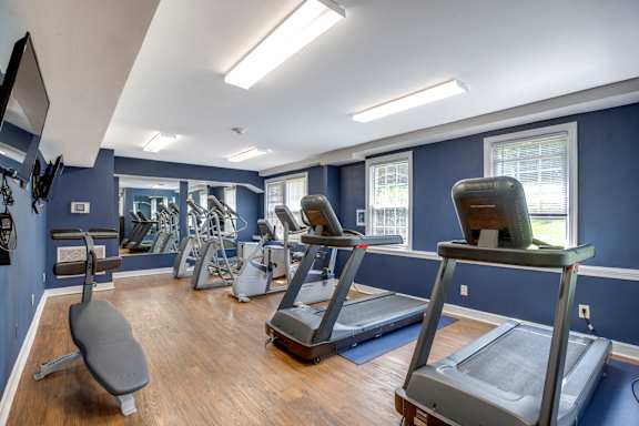 a fitness center with treadmills at Park Crest Apartments, District of Columbia 20007