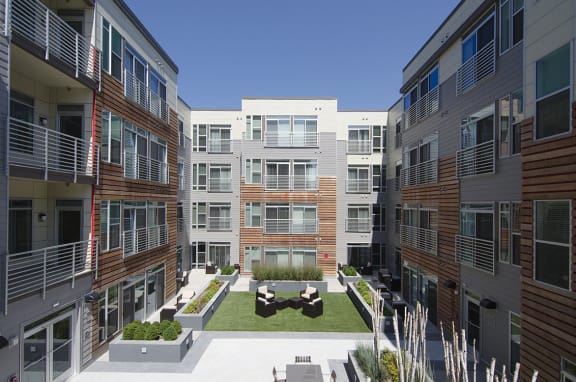 Building exterior and courtyard with grills at 2255 Wisconsin, Washington, 20007