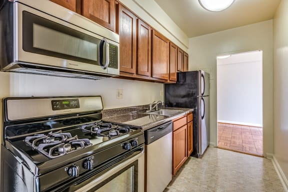 Renovated kitchen with stainless steel appliances at Idaho Terrace, Washington, 20016