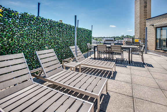 Rooftop with lounge seating and grills at The Livingston in the Chevy Chase neighborhood in Washington, DC 20015