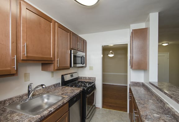Partially renovated kitchen with stainless steel appliances