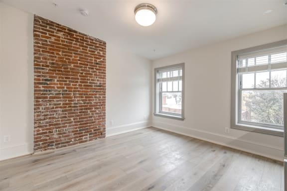 Studio 10 living space with exposed brick