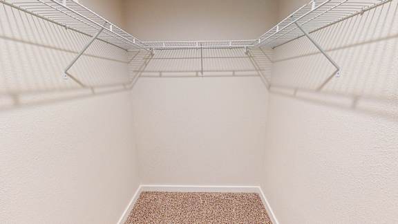 Empty white shelves in a pantry.