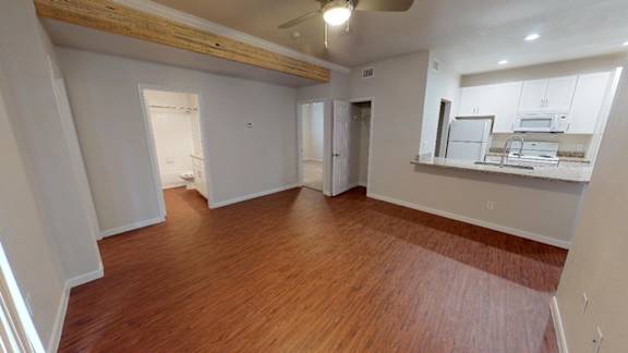 A room with wooden floors and white walls.