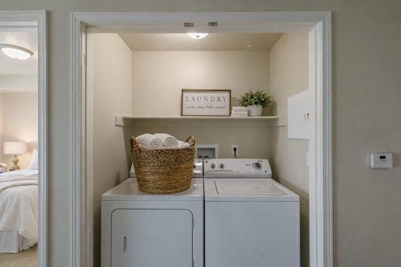 In unit laundry closet with washer and dryer at The Beckstead Apartments, South Jordan