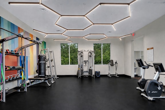 Fitness center with cardio and strength equipment at Prosper West Apartments, Waite Park, 56387
