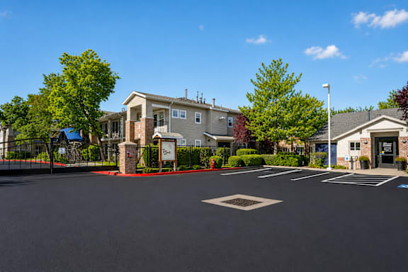 A sunny day at a residential area with houses and a clear blue sky.