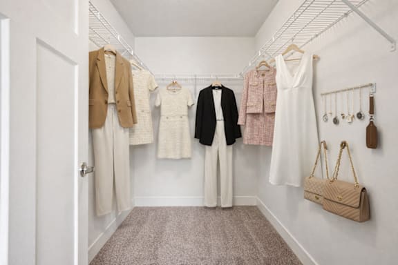 Walk-in closet with wire shelving and accessories at Connect at First Creek Apartments, Denver, 80249