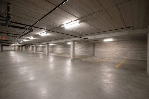 Underground parking garage with yellow striping at The Ponds at Heritage Place Apartments, Sartell, Minnesota
