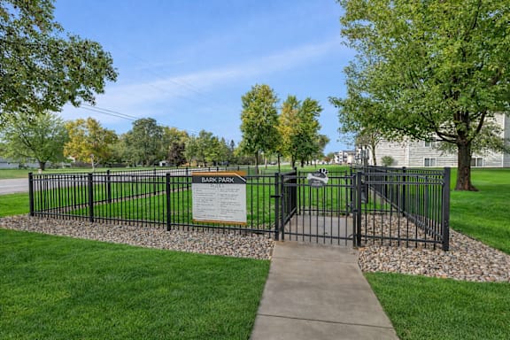 Bark park dog run with fenced enclosure at Prosper West Apartments, Waite Park