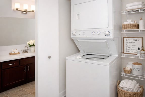A white washing machine in a laundry room.