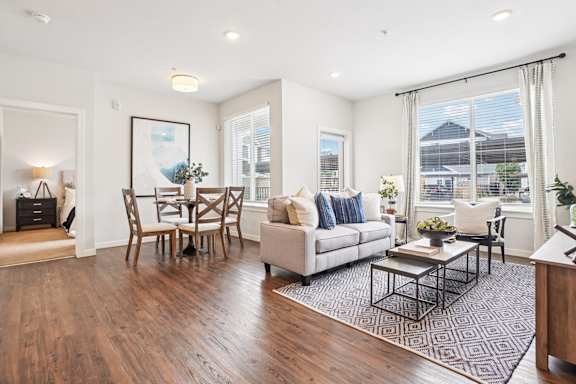 Open living and dining area with modern furnishings at Connect at First Creek Apartments, Denver, 80249