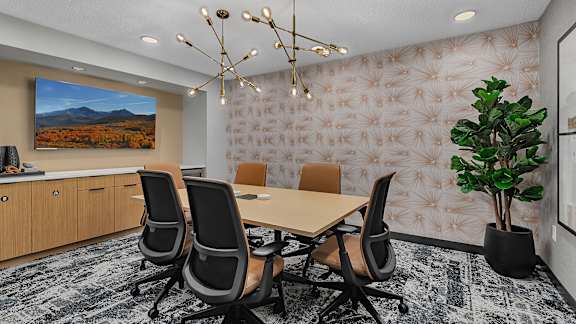Conference room with decorative wallpaper and modern lighting at Grand Gateway Apartments, Minnesota, 56301