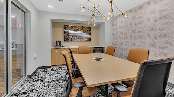 Conference room with modern lighting and nature artwork at Grand Gateway Apartments, St Cloud, MN 56301