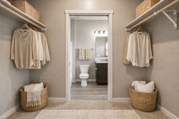 Walk-in closet with ensuite bathroom connection at Harper Ridge Apartments, Idaho