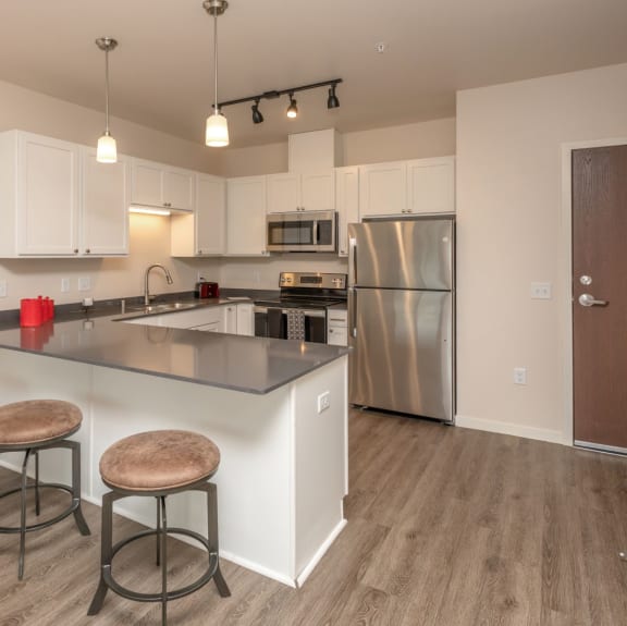 Fitted Kitchen With Island Dining at Cedar Green, Blaine, Minnesota