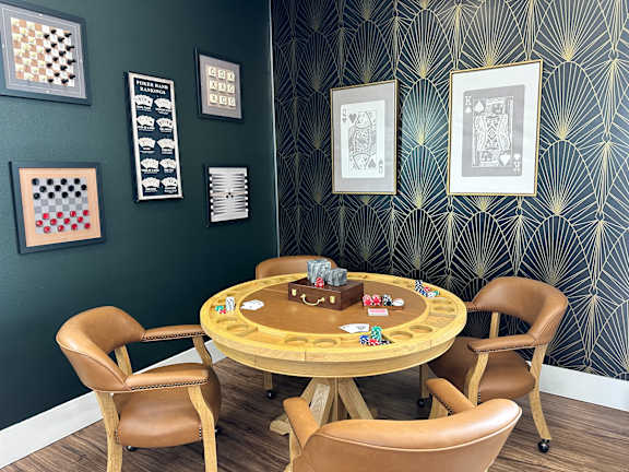 Game room with poker table and playing cards at Lofts at Innovation Center Apartments, Richland