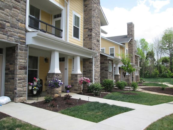 a sidewalk in front of a house