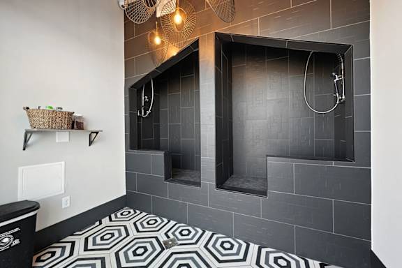 Pet spa with tile shower stations and floor mat at Sequel Homes Apartments, Englewood, 80110