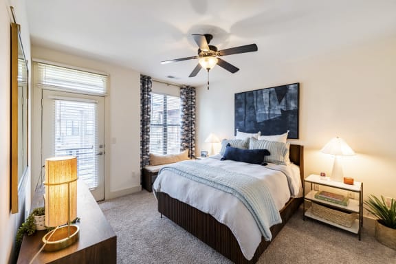 a bedroom with a large bed and a ceiling fan at Park and Kingston, North Carolina, 28203
