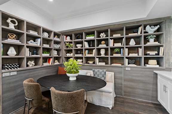 small seating area with built in shelving