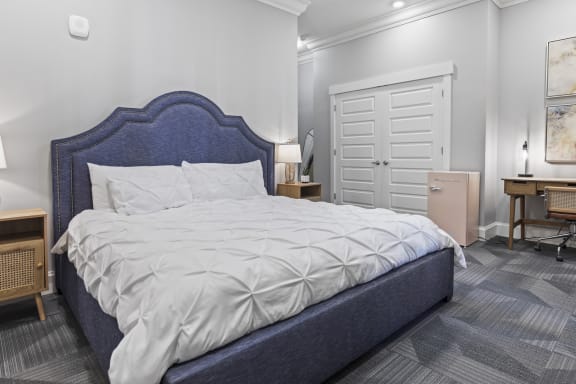 a bedroom with a bed and a dresser and a closet at Central Island Square, Daniel Island