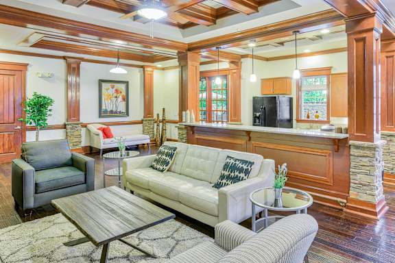 A living room with a couch, chair, and coffee table at The Lofts at Reynolds Village Apartments, North Carolina, 92627