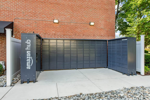 amazon hub package lockers in front of a brick building at Courthouse Square Apartments, Towson, 21286