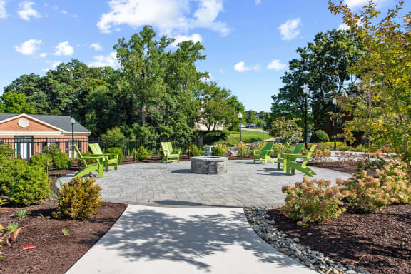 a patio with chairs and a fire pit at Courthouse Square Apartments, Maryland