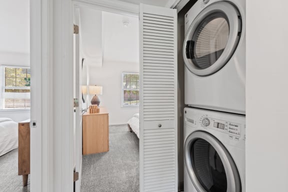 a small laundry room with a washing machine and a dryer at Courthouse Square Apartments, Maryland, 21286