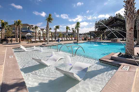 Poolside area with loungers at Elevate at Brighton Park, Summerville