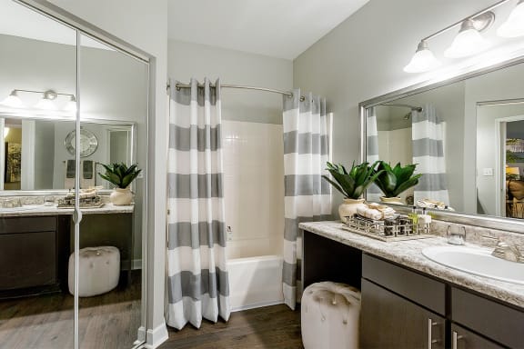 bathroom with sink and shower with curtain at Fortress Grove, Murfreesboro, Tennessee