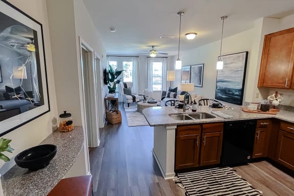 Open living area kitchen looking into bedroom at Two Addison Place Apartments , Pooler, 31322