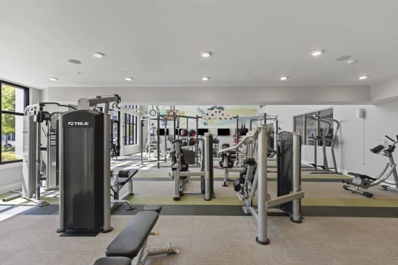 a gym with weights and cardio equipment in a building at Central Island Square, Daniel Island, South Carolina