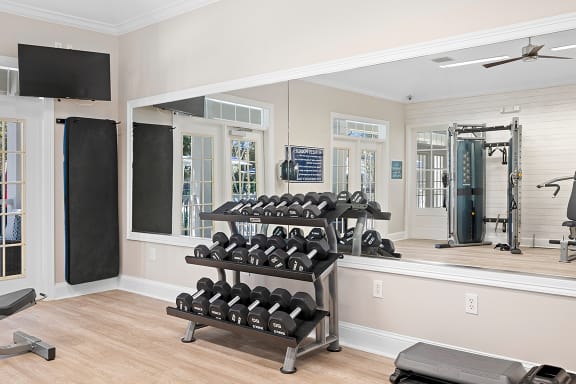 the residence on lamar apartment homes fitness room with weights and mirrors