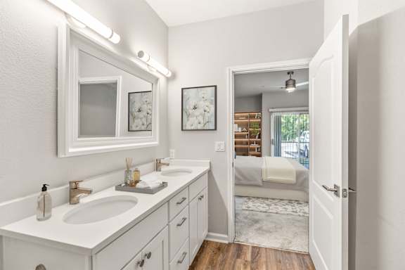 A white bathroom with a vanity and a mirror at Sweetgrass Landing, Mount Pleasant, South Carolina, 29466