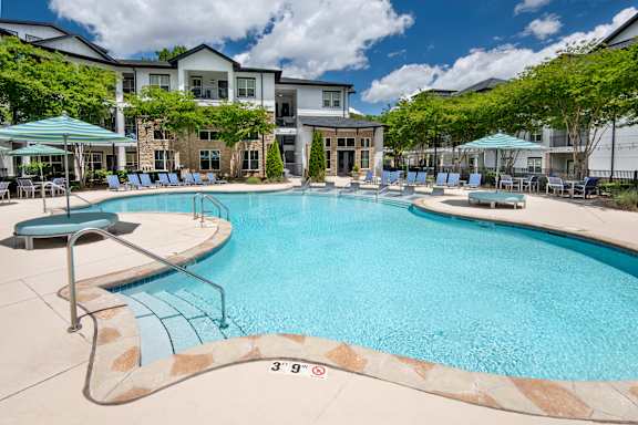 A large swimming pool with a depth of 3 feet 9 inches.