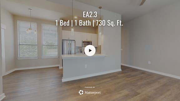 A bedroom with a bed and a bathtub in a 730 square foot space.