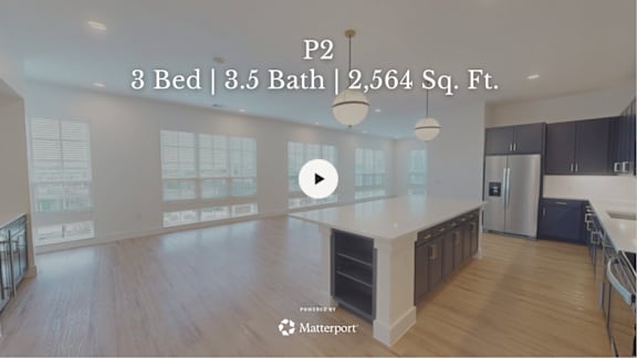 A kitchen with a play button overlay.