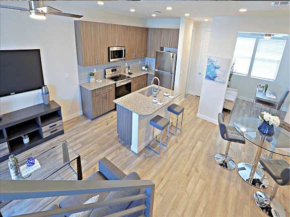 A modern kitchen with a bar area and a dining table, Scottsdale Hayden Townhomes, Scottsdale, AZ