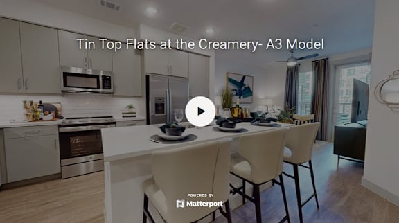 A modern kitchen with a title text "Tin Top Flats at the Creamery- A3 Model".