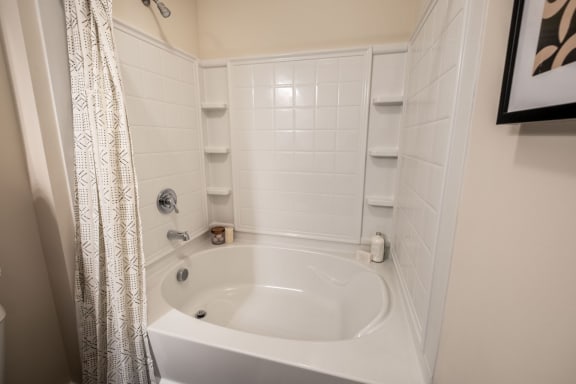 Oval Tub With Combo Shower at Abberly CenterPointe Apartment Homes by HHHunt, Midlothian