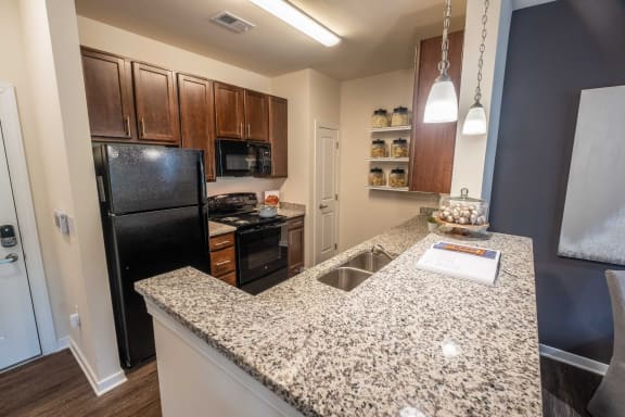 Granite Kitchen Worktops at Abberly CenterPointe Apartment Homes by HHHunt, Midlothian, VA