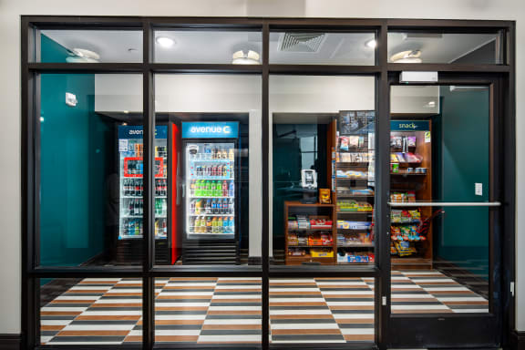 the front of a store with large windows and a checkered floor at Abberly Foundry Apartment Homes, Nashville