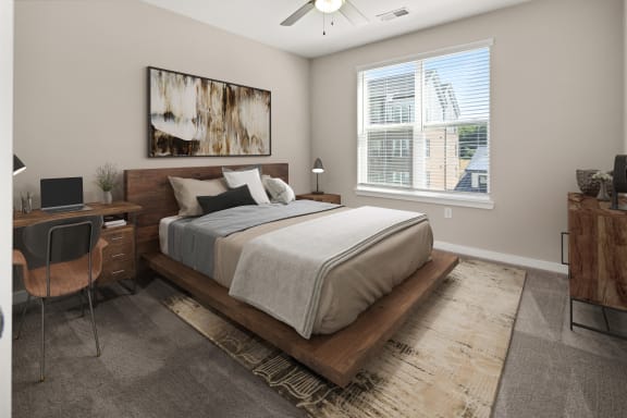 a bedroom with a bed and a desk with a window