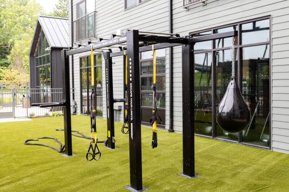 a home gym with a swing set on the lawn at Abberly Riverwalk Apartment Homes, Nashville, 37228