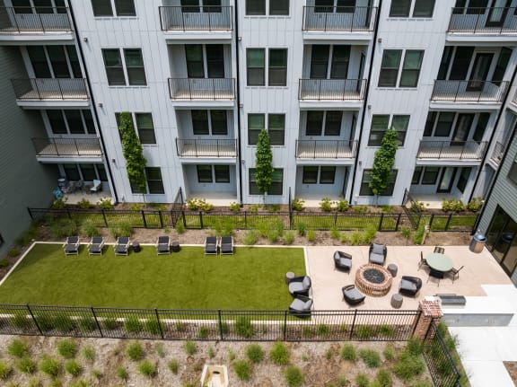 an aerial view of an apartment building with a lawn and fire pit  at Abberly Riverwalk Apartment Homes, Tennessee, 37228