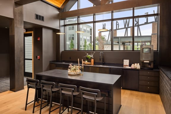 a kitchen with a large island and a large window  at Abberly Riverwalk Apartment Homes, Nashville, Tennessee